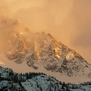 Steep mountain ridge next to Aiguille du Dru in the last afternoon sunlight, Chamonix area, Haute-Savoie, Mont Blanc area, France, February Steep mountain ridge next to Aiguille du Dru in the last afternoon sunlight, Chamonix area, Haute-Savoie, Mont Blanc area, France, February