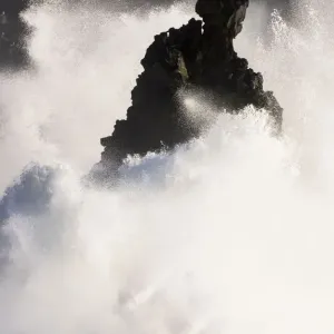 Storm waves breaking against cliffs at Svortuloft, Iceland April 2016