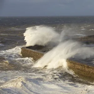 Storm waves from an extreme low pressure system batter Whitehaven harbour, Cumbria