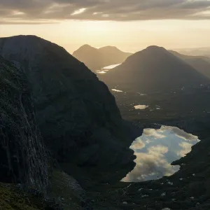 Sunset over Loch Coire Mhic Fhearchair from Beinn Eighe with the sky reflected in the water