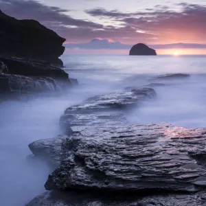 Sunset at Trebarwith Strand with incoming tide, North Cornwall, UK. March 2014