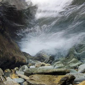 Underwater landscape within a mountain stream, showing water turbulence, Snowdonia NP