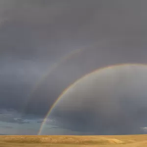 View of a double rainbow over steppe grassland, Mongolia, 2018