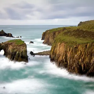 View of waves crashing against the cliffs at Land's end, Cornwall, England, UK. March 2010 View of waves crashing against the cliffs at Land's end, Cornwall, England, UK. March 2010