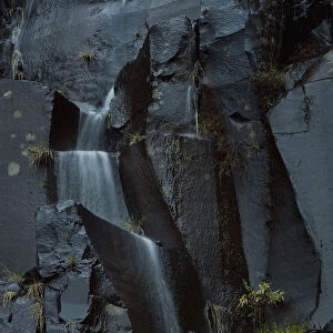 Water falling over basalt stones, Paul de Serra mountains, Madeira, March 2009