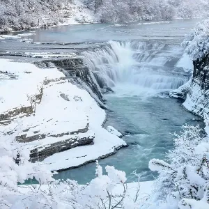 Waterfall and cascades on partially frozen Paine River in winter, Torres del Paine National Park, Patagonia, Chile. July, 2022 Waterfall and cascades on partially frozen Paine River in winter, Torres del Paine National Park, Patagonia, Chile. July, 2022