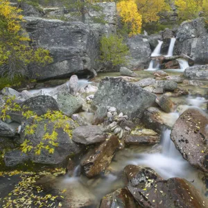 Waterfall cascading through rocky gorge in autumn, Stor-Elvdal, near Rondane National Park