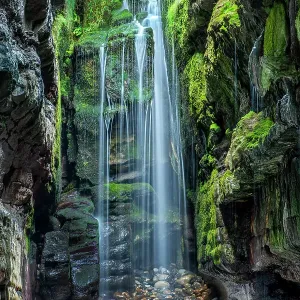 Waterfall in secluded coastal cave, near Largy, County Donegal, Ireland. September. 2021 Waterfall in secluded coastal cave, near Largy, County Donegal, Ireland. September. 2021