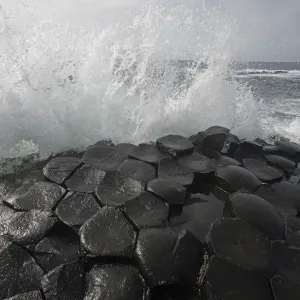 Wave crashing onto basalt rocks, Giants Causeway, Unesco Heritage Site, Northern Ireland