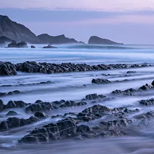 Welcombe Mouth at high tide, evening light, taken with long exposure, Welcombe, North Devon, UK. April