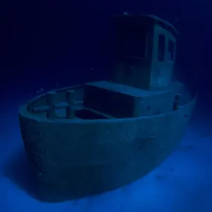 Wreck of tugboat Blue Plunder at night off Nassau, Bahamas Wreck of tugboat Blue Plunder at night off Nassau, Bahamas
