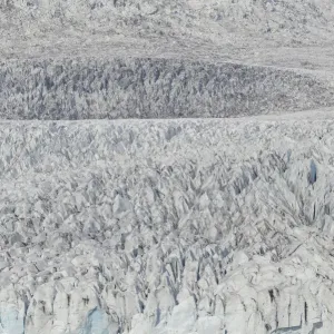 Zodiac carrying visitors navigating among ice floes at foot of Fjallsarlon Glacier, Iceland. July Zodiac carrying visitors navigating among ice floes at foot of Fjallsarlon Glacier, Iceland. July