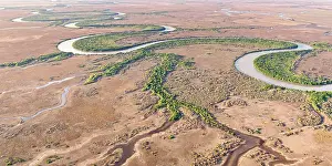 Aerials Prints: Aerial view of the famouss bends of the lower Adelaide River flowing through seasonal floodplains in the late dry