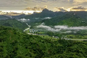 Aerial view of a Fijian village on the banks of a river in Namosi Province in the forested interior of Viti Levu, Fiji. June, 2023