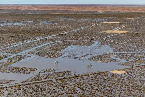 South Australia Prints: Aerial view over flooded mining infrastructure in the Lake Eyre basin