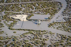 South Australia Prints: Aerial view over flooded mining infrastructure in the Lake Eyre basin