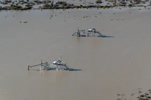 South Australia Prints: Aerial view over flooded mining infrastructure in the Lake Eyre basin