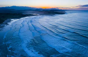 Aerial view of Gerra beach and sea at twilight, Oyambre Natural Park Aerial view of Gerra beach and sea at twilight, Oyambre Natural Park