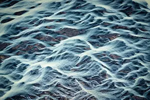 Cryptic Prints: Aerial view of a glacier river, Iceland. May, 2023