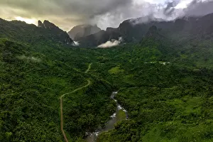 Fiji Prints: Aerial view of a gravel road leading through a river valley in the lush and mountainous Namosi Province