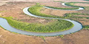 Aerial View Prints: Aerial view of the lower Adelaide River flowing through seasonal floodplains in the late dry season