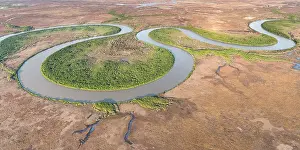 Aerial View Prints: Aerial view of the lower Adelaide River flowing through seasonal floodplains in the late dry season