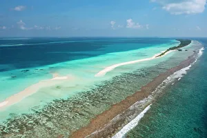 Maldive Islands Prints: Aerial view along reef and sandbank to Dhigurah island