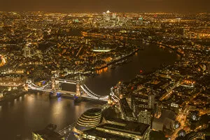 Artifical Light Gallery: Aerial view of River Thames and Tower Bridge in London at night. October 2014