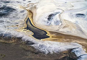 Aerial View Gallery: Aerial view after sunrise, showing the sun reflecting off water that has flowed into Lake Eyre South