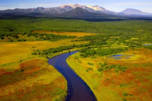Volcanoes Prints: Aerial view of the Tikhaya River flowing through the colourful tundra in autumn