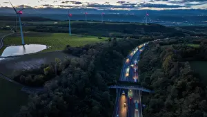 Equipment Prints: Aerial view of a wildlife crossing over the A7 highway at dusk