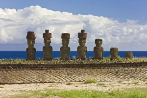 Anakena beach, monolithic giant stone Moai statues of Ahu Nau Nau, four of which have topknots
