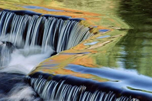 Waterfalls Gallery: Autumn colours reflected in river water. Michigan, USA