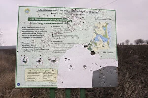 Battered sign showing the information about the area around Durankulak Lake, Bulgaria