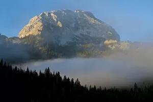 Images Dated 6th October 2008: Big Bear peak with morning mist over forest, Durmitor NP, Montenegro, October 2008