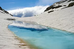 Spain Collection: Blue ice melt pool in snow near the peak of La Munia Circo. The Pyrenees, Aragon
