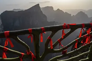 Buddhism Prints: Buddhist prayer flags tied on ornate railings