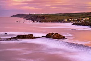 Cornwall Gallery: Bude breakwater and coastal view looking North at high tide and sunrise. Cornwall, UK. January