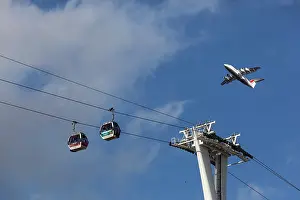 London Prints: Cable cars across the River Thames at Greenwich with aeroplane high above