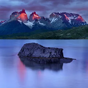 2019 December Highlights Prints: Central Massif and towers of Torres del Paine National Park at sunrise, island reflected