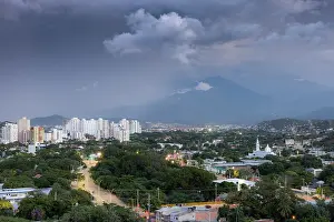 Colombia Prints: The city of Santa Marta below the slopes of the Sierra Nevada de Santa Marta under a dark sky