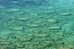 Clear sea water showing stones beneath surface, Karpaz Peninsula, North Cyprus, April