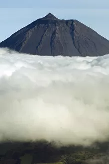 Images Dated 14th June 2009: Clouds around Pico, the highest mountain in Portugal, sticking out through a loayer of clouds