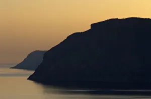 Images Dated 18th April 2009: Coastal cliffs silhouetted at dawn near Mochlos, Crete, Greece, April 2009