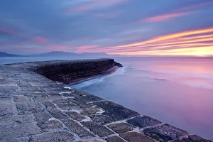 Time Exposure Prints: The Cobb, Lyme Regis, colourful sunrise, West Dorset, UK. England, January 2010