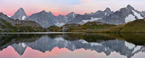 Physical Geography Prints: Colourful pink sky at dawn reflected in Fenetre Lake / Lac de Fenetre in Swiss Alps