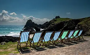 Travel Prints: Deck chairs overlooking the National Trust Kynance Cove on a sunny day