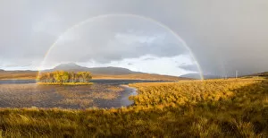 Aidan Maccormick Gallery: Double rainbow emmerging from rain shower over Loch Awe, Assynt, Scotland, UK, November 2016