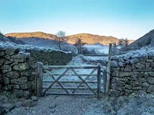 Cold Weather Prints: Drystone wall and wooden gate covered in frost on misty morning in Borrowdale