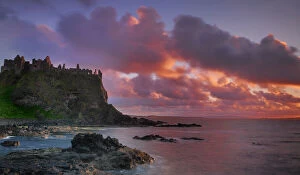 Dunluce Castle at sunset, North Antrim coast, County Antrim, Northern Ireland, UK